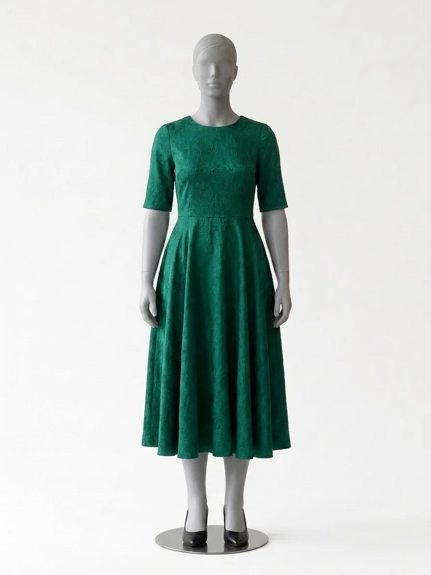 AI render of an emerald floral jacquard fit-and-flare midi on our size 12 mannequin