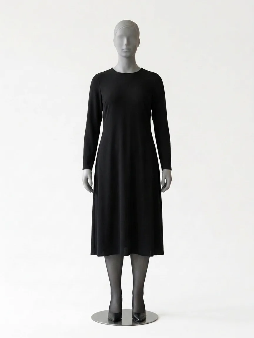 AI render of a black long-sleeve midi dress with sheer black tights and black pumps on our size 12 mannequin