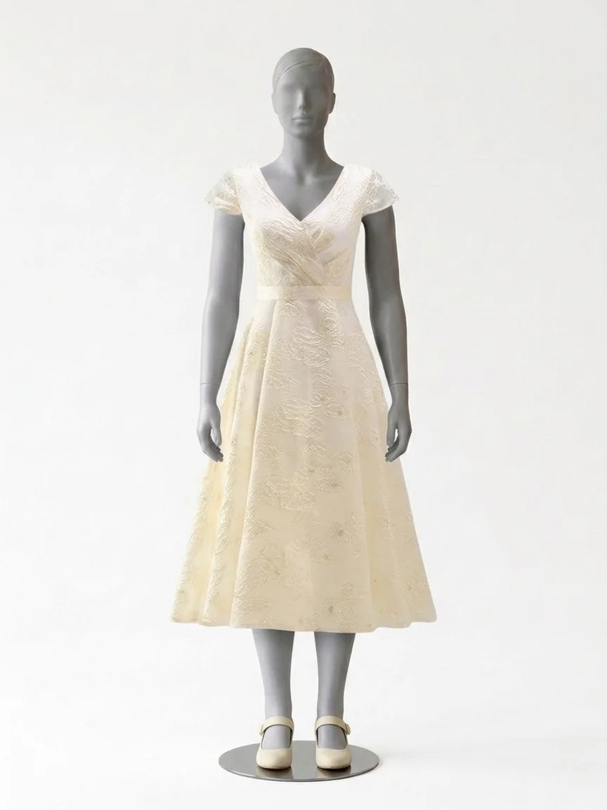 AI try-on render of the Zapaka champagne floral jacquard midi dress with cream Mary Jane heels on our size 12 mannequin