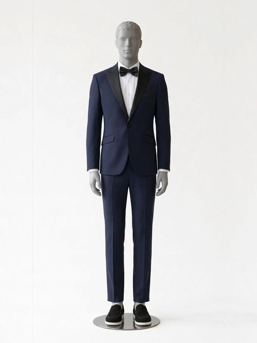 AI try-on render of the Zapaka navy peak lapel suit with a black satin lapel and black loafers on our men's mannequin