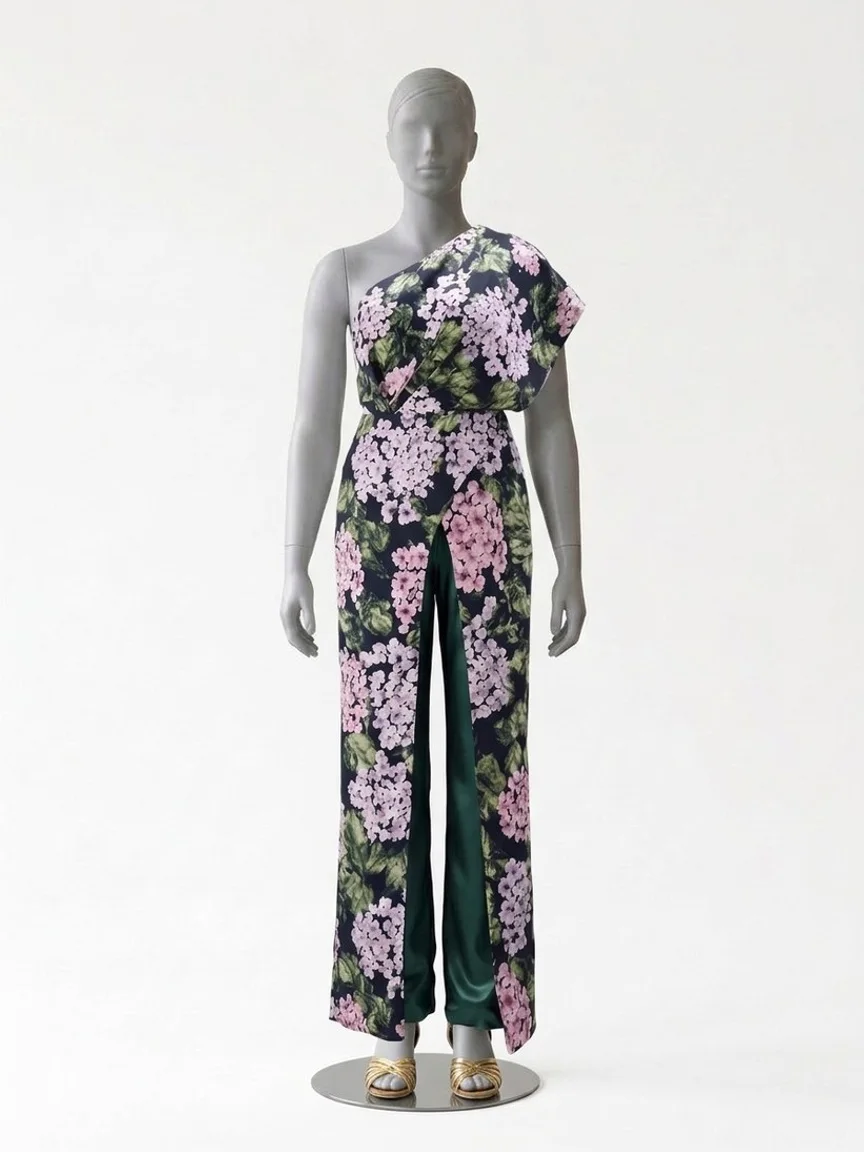 AI try-on render of the Zapaka dark green floral one-shoulder jumpsuit with gold low-heel sandals on our size 12 mannequin